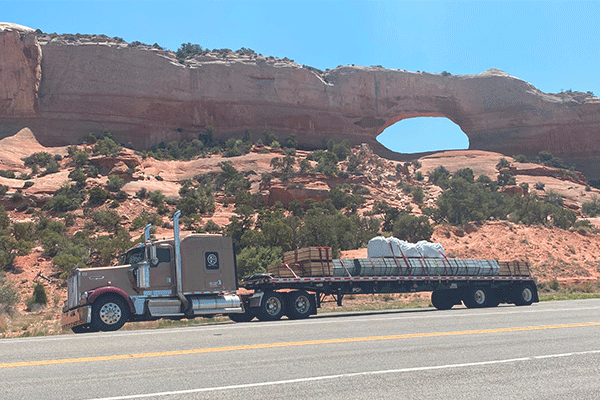 semi truck parked on the side of highway
